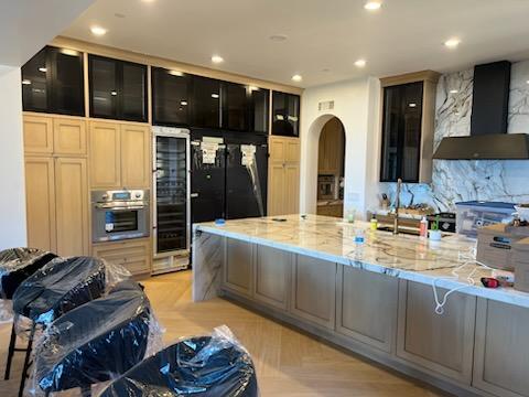 A modern kitchen featuring elegant marble countertops and stylish cabinets.